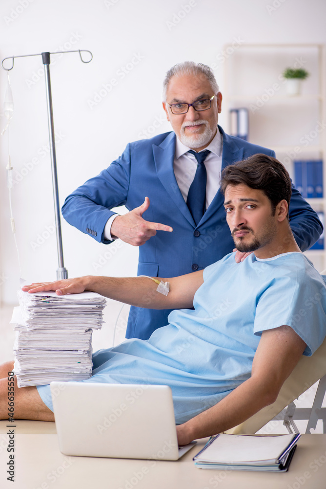 Fototapeta premium Young male employee feeling bad at workplace