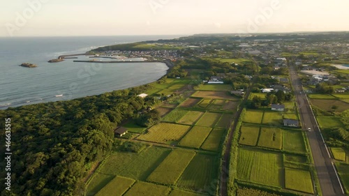 Aerial Over Farms, Fields, And Sea Near Tsuno Port In Kyushu, Japan photo