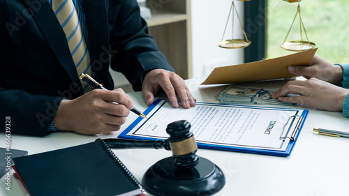 Photos When the court receives money from the businessman in exchange for help The unfair judgment is corruption and bribery, the lawyer holds the pen to sign the contract