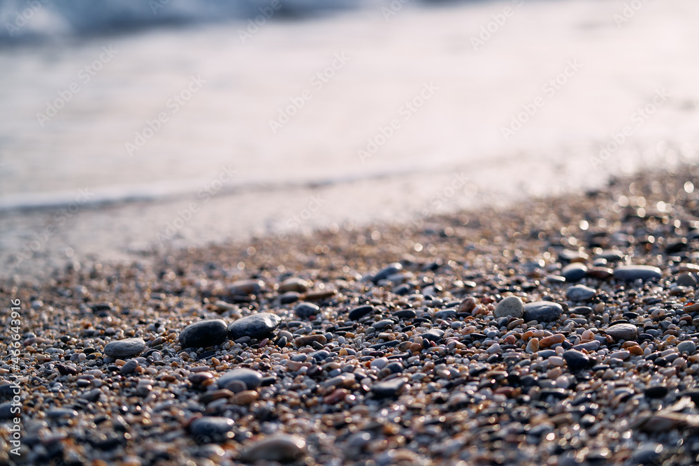 Pebbles on the sea beach. Background and texture. Travel and adventure. Pebbles on the sea beach. Background and texture. Travel and adventure.