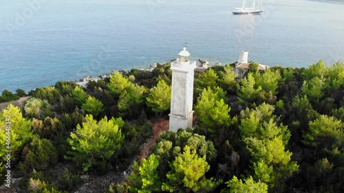 Venetian Lighthouse In Fiskardo Bay, Cephalonia Island, Greece. Aerial Orbit photo