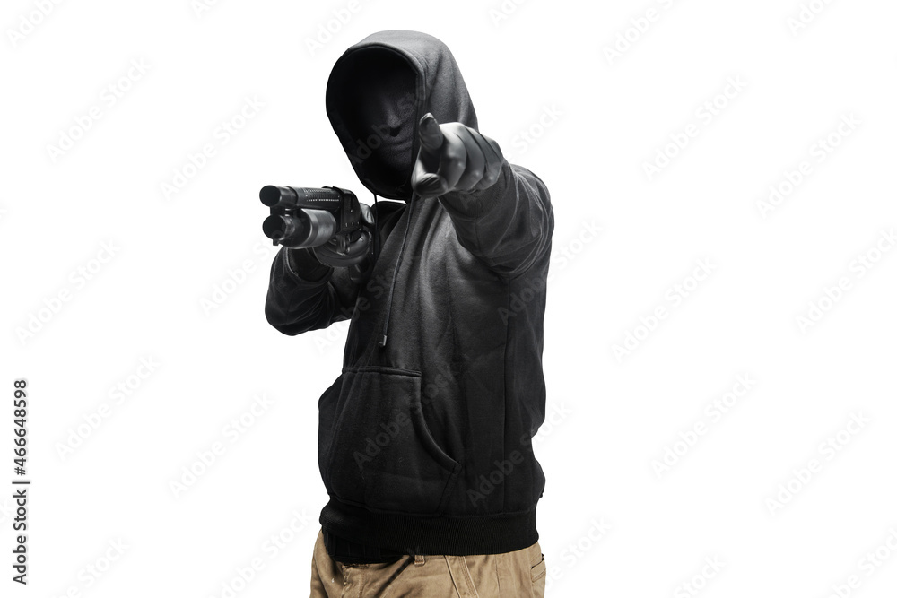 A criminal man in a hidden mask hold the shotgun and pointing something