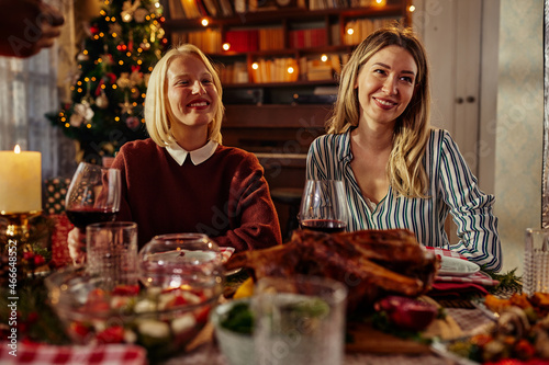 Two female friends are gathering for christmas holiday