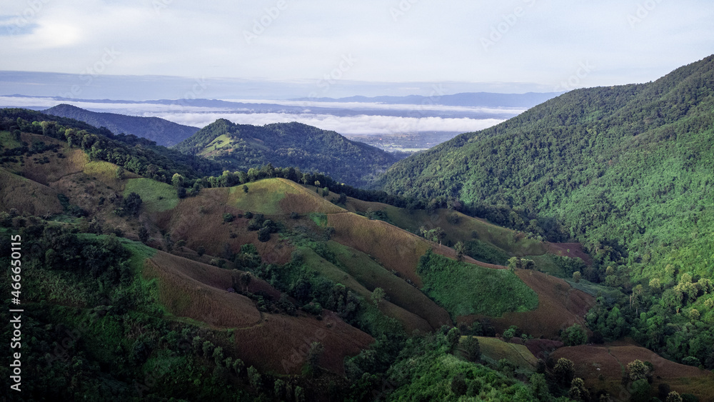 Fototapeta premium Landscape of Doi Sakad mountain valley in Pua, Nan Province, Thailand during rainy season. Photo from aerial view by drone