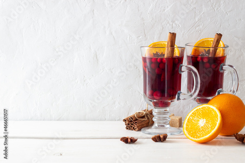 Mulled wine with cinnamon, cranberry and orange. Hot drink. Winter. photo