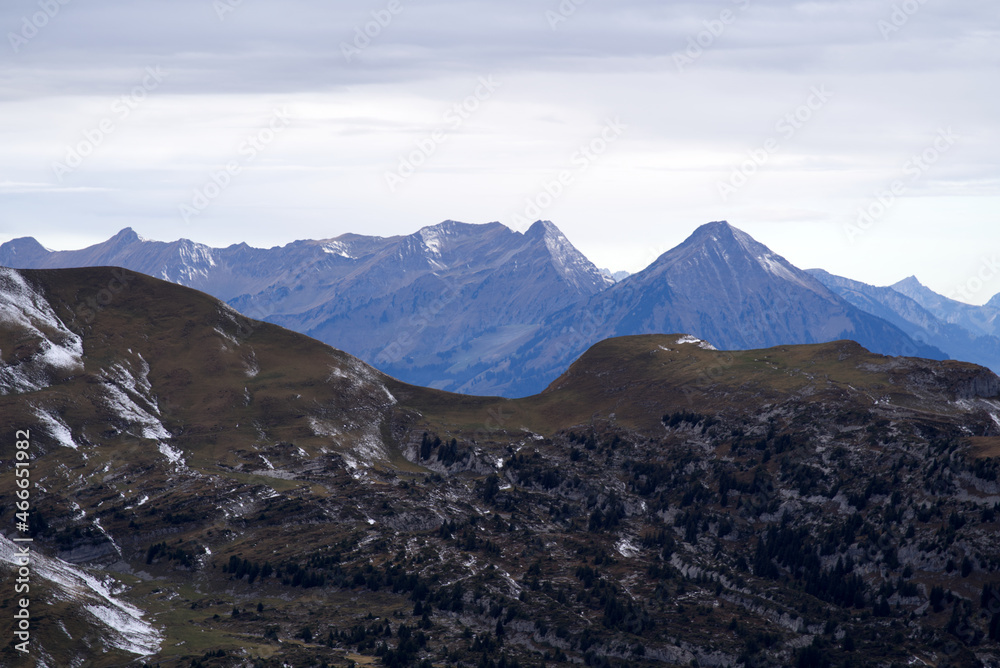 Mountain panorama seen from Axalp at Bernese Highlands on a grey cloudy autumn day. Photo taken October 19th, 2021, Brienz, Switzerland.