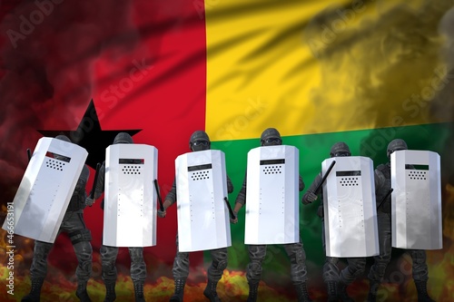 Φωτογραφία Guinea-Bissau protest stopping concept, police swat in heavy smoke and fire prot
