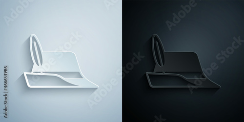 Paper cut Oktoberfest hat icon isolated on grey and black background. Hunter hat with feather. German hat. Paper art style. Vector
