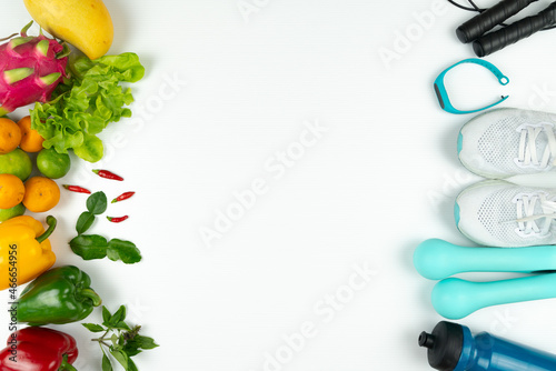 Healthy lifestyle, food and sport concept. athlete's equipment and fresh fruit on white background.