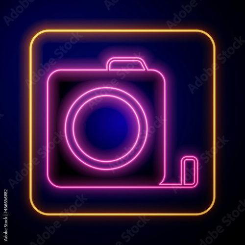 Glowing neon Roulette construction icon isolated on black background. Tape measure symbol. Vector