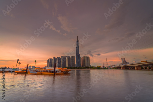 Sunset on Landmark 81 - a super tall skyscraper of Vinhomes Central Park Project, viewed from Binh An waterbus station, Ho Chi Minh city, Vietnam