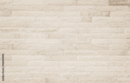Empty background of wide cream brick wall texture. Beige old brown brick wall concrete or stone textured wallpaper backdrop.