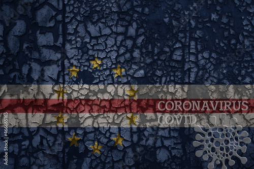 flag of cape verde on a old metal rusty cracked wall with text coronavirus, covid, and virus picture.
