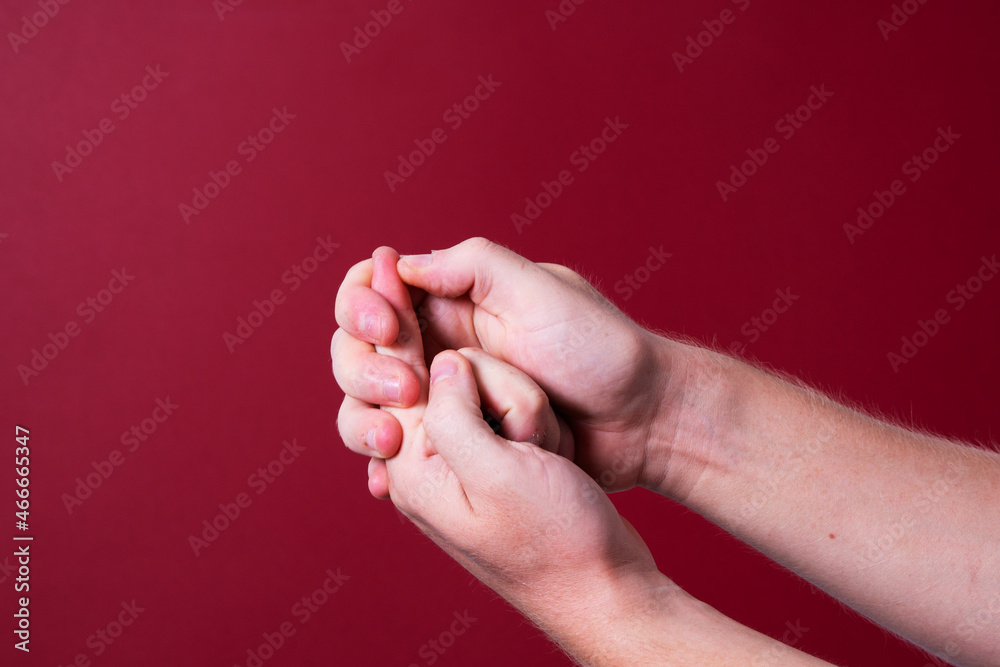 a man massages his hands from chilling pain a man massages his hands from chilling pain