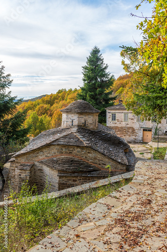 The picturesque moni Rogovouduring fall season the stone build church is  located  near tsepelovo aboves vikos gorge on Tymfi mounain t, Zagori, Epirus, Greece. photo