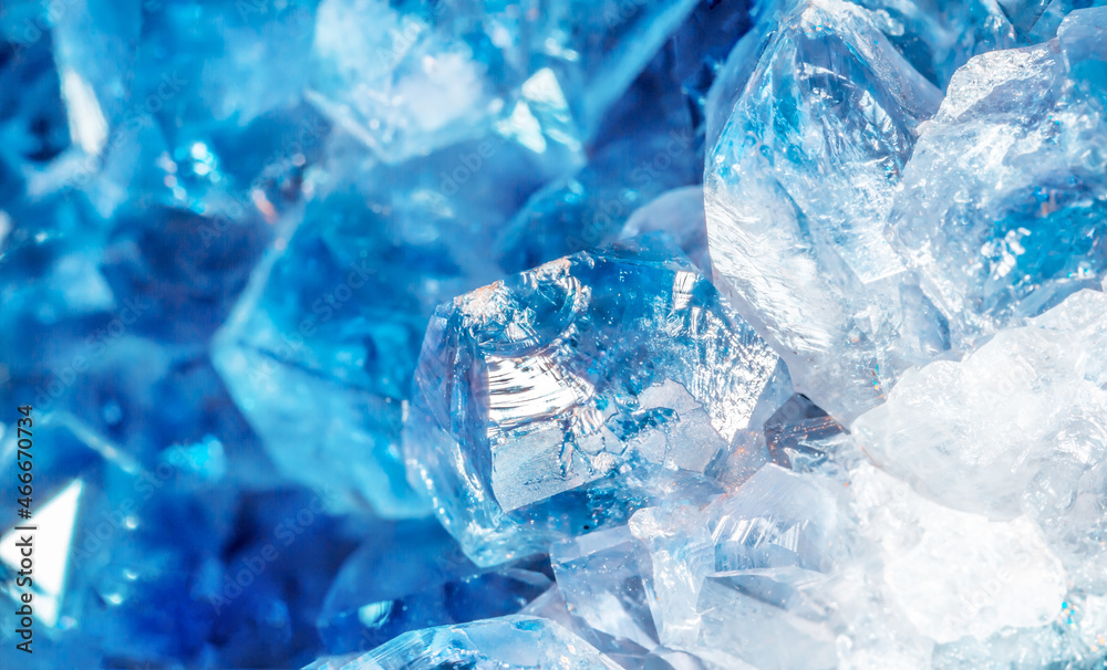 Blue Crystal Mineral Stone. Gems. Mineral crystals in the natural environment. Texture of precious and semiprecious stones. Seamless background with copy space colored shiny surface of precious stones Blue Crystal Mineral Stone. Gems. Mineral crystals in the natural environment. Texture of precious and semiprecious stones. Seamless background with copy space colored shiny surface of precious stones