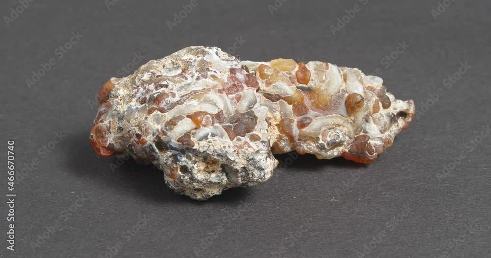 Agate geode on a dark background. Outer shell. Agate geode on a dark background. Outer shell.