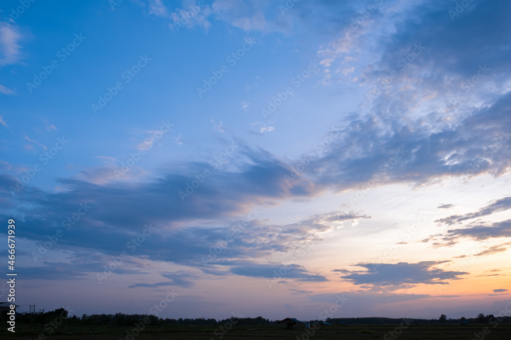 Colorful sunset and sunrise with clouds.Blue and orange color of nature.Many white clouds in the blue sky.The weather is clear today.sunset in the clouds.The sky is twilight. Colorful sunset and sunrise with clouds.Blue and orange color of nature.Many white clouds in the blue sky.The weather is clear today.sunset in the clouds.The sky is twilight.