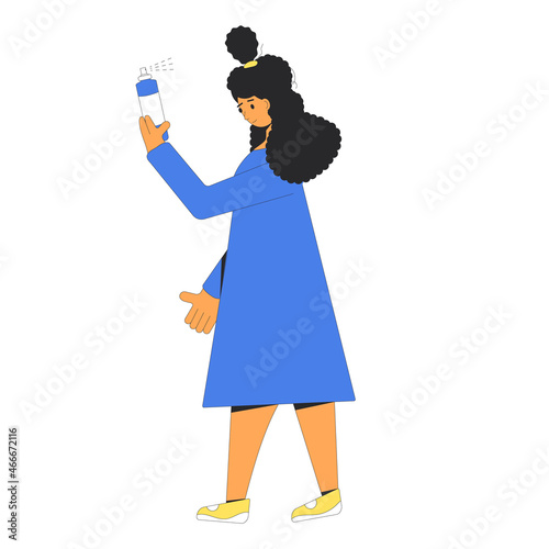 Young woman spray her dark curly hair.