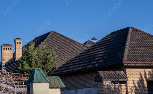 Roof with brown metal tiles.