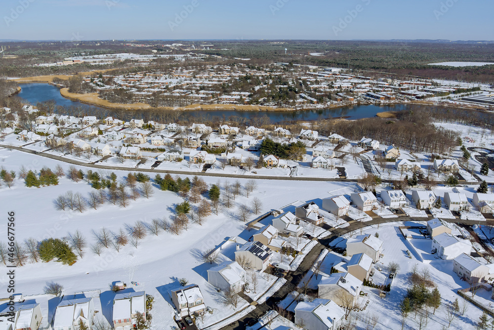 Aerial view winter landscape American town small homecomplex of a snowy winter on the streets after snowfall