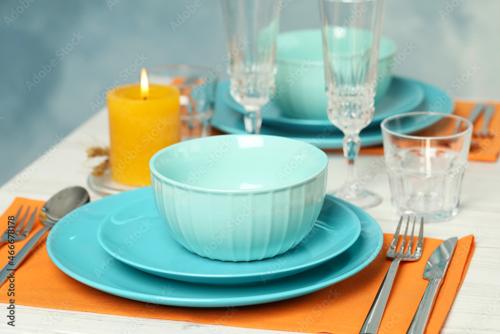 Elegant festive setting on white wooden table Elegant festive setting on white wooden table