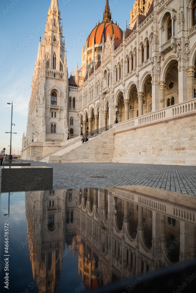 view of the facade of the parliament building of budapest hungary at sunset