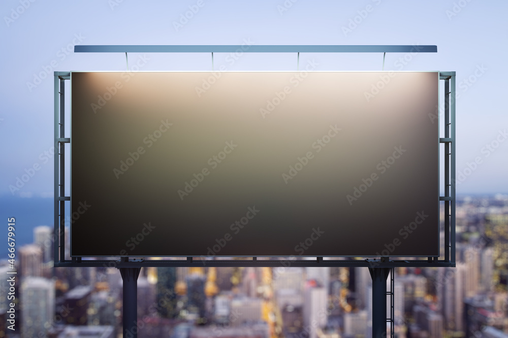 Blank black horizontal billboard on skyline background at evening, front view. Mock up, advertising concept Blank black horizontal billboard on skyline background at evening, front view. Mock up, advertising concept