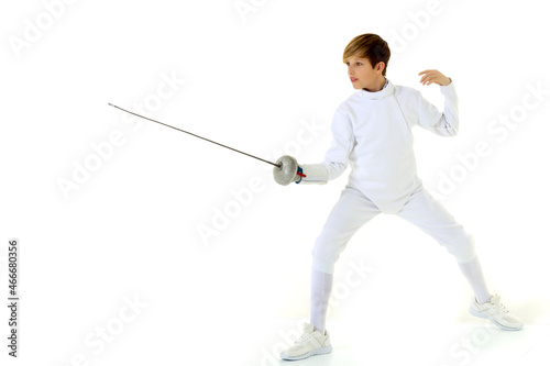 Boy fencer standing in attacking pose © lotosfoto