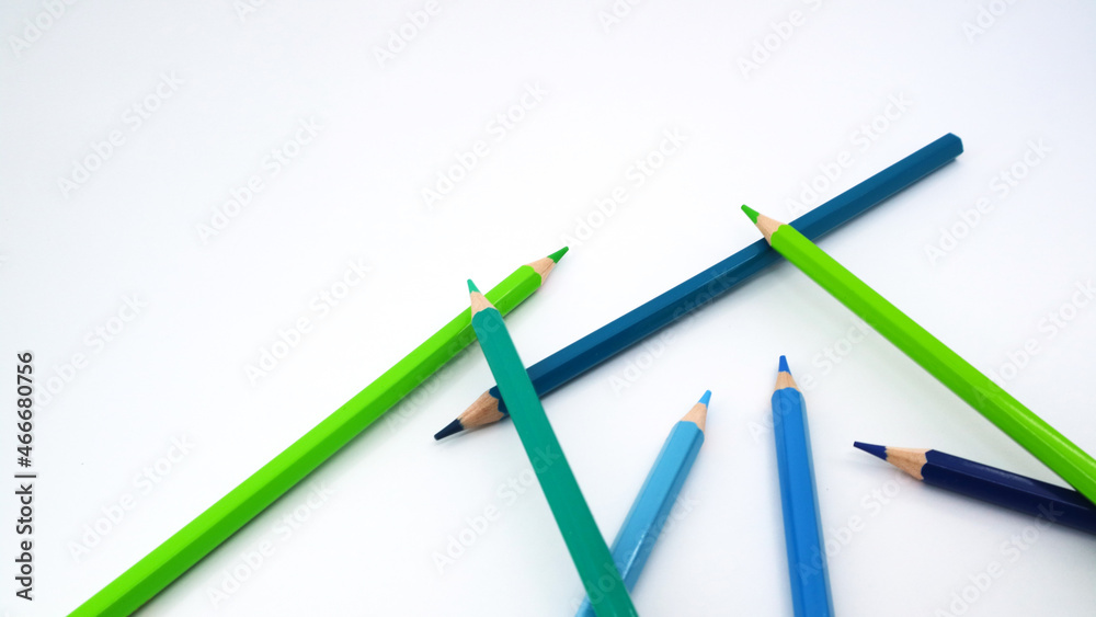 Stack of colorful pencils on white desk table, with copy space Stack of colorful pencils on white desk table, with copy space