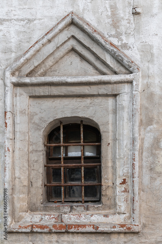 latticed windows and a fragment of the facade of an ancient brick building