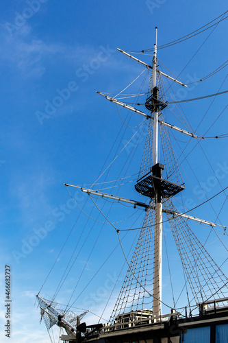 Rigging of a sailing ship against the blue sky.