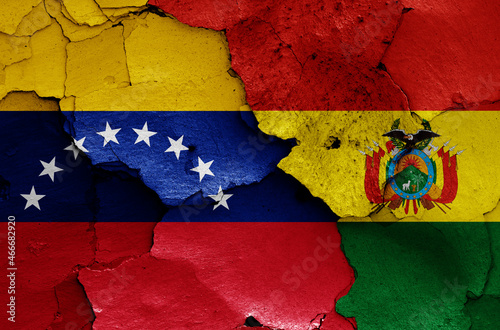 flags of Venezuela and Bolivia painted on cracked wall