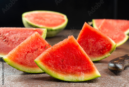 Fresh sliced watermelon on dark background
