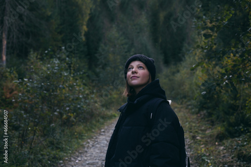 Young woman walking in the woods