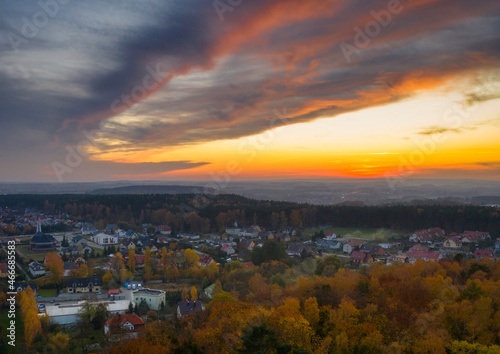 Beautiful sunset over the autumnal forest in Rotmanka, Poland © Patryk Kosmider