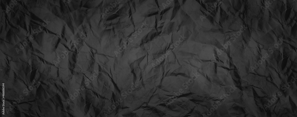 Rugged wrinkled crumpled dark black paper texture background Rugged wrinkled crumpled dark black paper texture background