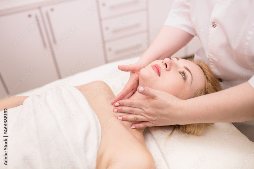 Beautician makes facial massage girl. Lymphatic drainage massage LPG, apparatus process. Beauty treatments at the beauty salon SPA. Liquefied gas and contour treatment of the face and body. Skin care. Beautician makes facial massage girl. Lymphatic drainage massage LPG, apparatus process. Beauty treatments at the beauty salon SPA. Liquefied gas and contour treatment of the face and body. Skin care.