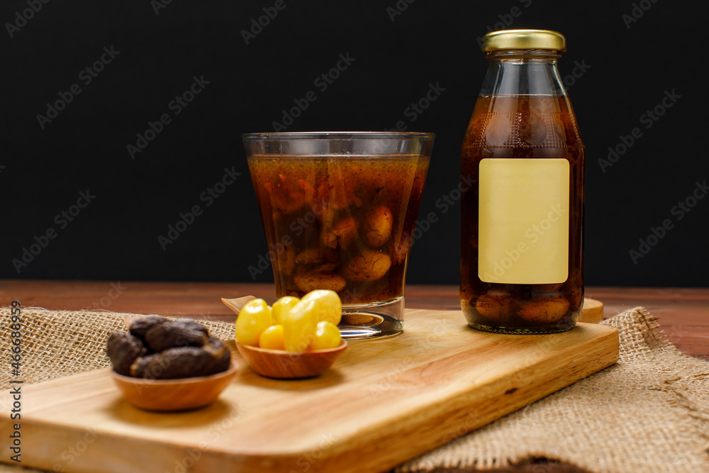 Advertising glass bottles of tasty organic drink product for health refreshment extract from natural herb and fruit of ginkgo, longan, and Malva nut Advertising glass bottles of tasty organic drink product for health refreshment extract from natural herb and fruit of ginkgo, longan, and Malva nut