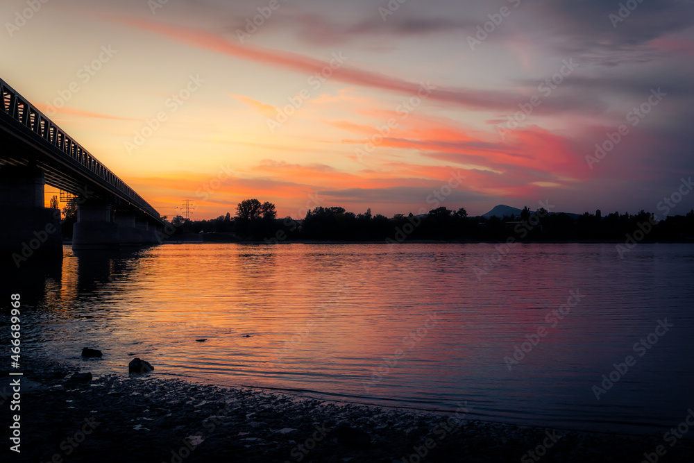 Sunset at the Danube river in Budapest, Hungary during a hot evening in the summer