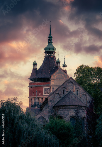 The Vajdahunyad Castle in Budapest, Hungary at a summer evening with a cloudy sky