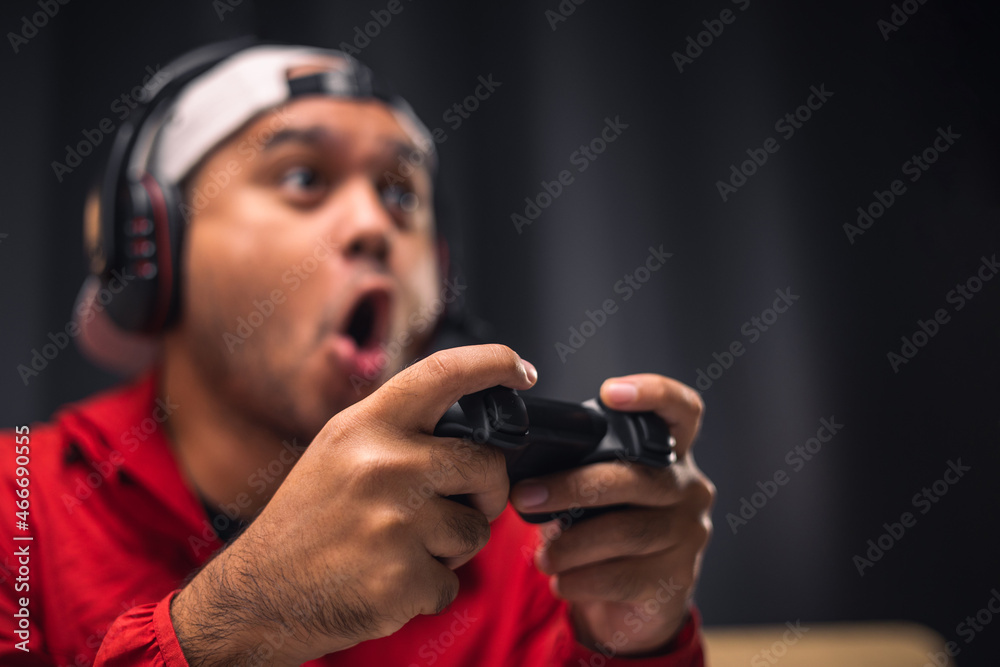 Close up male hands holding joystick game console. Young man playing video game online. Close up male hands holding joystick game console. Young man playing video game online.