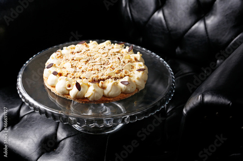Shortcrust pastry with apples, meringue and nuts. Sweet dessert.
A tasty dish.Culinary photography. Suggestion to serve the dish.