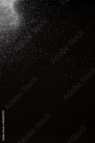 White splashing water on black background