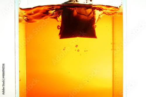Steep tea bag in hot water photo