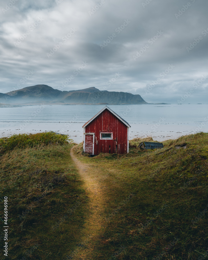 A typical red and colorful cottage of the Norwegian culture and architecture in Norway . High quality photo - obrazy, fototapety, plakaty 