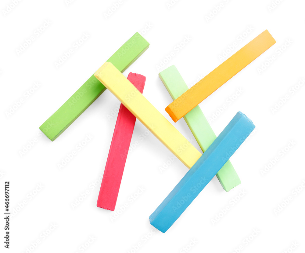 Colorful pastels on white background, top view. Drawing materials Colorful pastels on white background, top view. Drawing materials