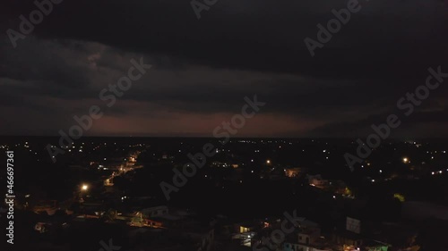 Wallpaper Mural Aerial panoramic footage of modestly illuminated streets in night town. Heavy clouds and storm with lightning in distance. Valladolid, Mexico Torontodigital.ca