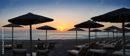 Beach Umbrellas with sunset