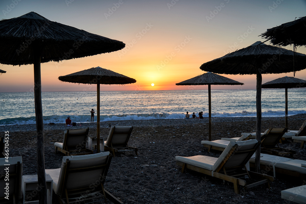 Beach Umbrellas with sunset